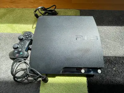 PS3 slim and 2 controllers x5 games