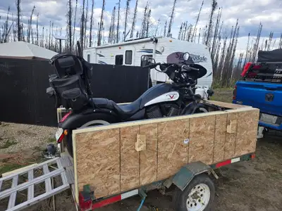4.5x8 built into a camping rig thats lockable and keeps things dry, top slids out to a table and whe...