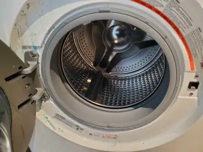 Appliance repair - washer repair with water leaking at front, View more