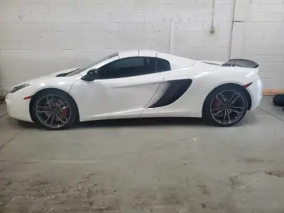 Best priced low mileage MP4-12C Spyder in Canada. 612HP 0-60 in 3.0 sec Original color is Volcano Re...