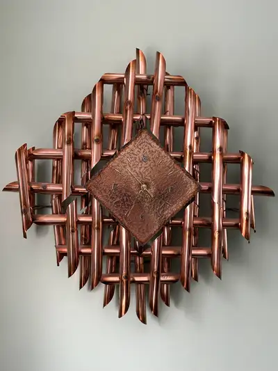 From 1960’s with a Brutalist design aesthetic. The abstract use of overlapping copper tubes is an ar...
