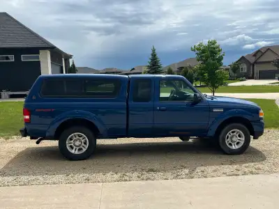 2010 Ford Ranger Sport Extended Cab, 2 wheel drive, 4.0 litre automatic, paint match cap, box liner,...