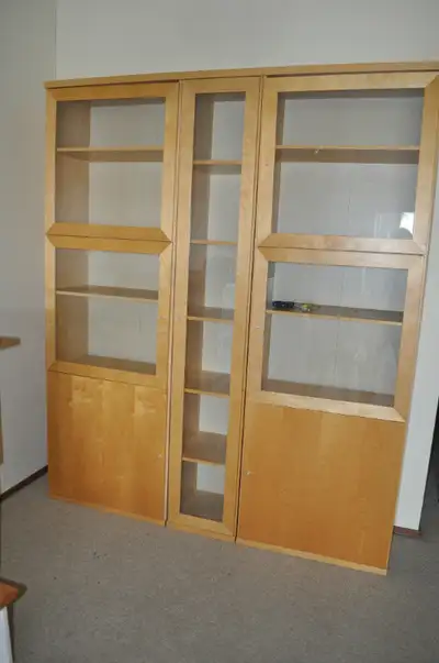 Modern 3 section display cabinet with glass doors, 3 sections. light colored wood veneer, 86" high x...