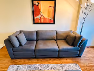Charcoal Sectional Sofa 1 armless and 2 corners Amazing couch to lounge and snuggle on!! The covers...