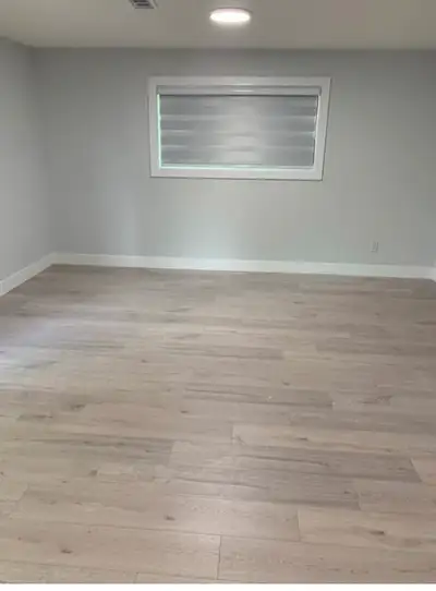 This newly constructed basement boasts 2 bedrooms and 1 bathroom. It features laminate flooring, bli...