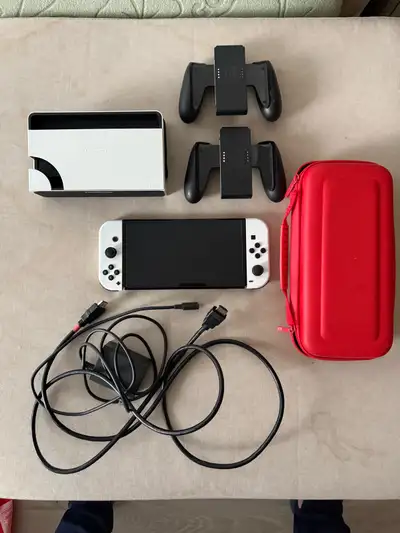 Nintendo Switch OLED w/ Carrying Case, View more