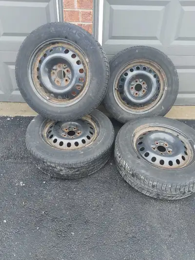 Set of four Michelin X-Ice Snow Tires on steel rims. 225/60 R17 size. Fair condition some surface ru...