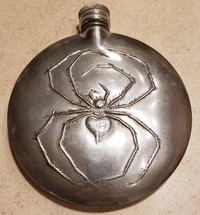 Drinking flask with embossed black widow design