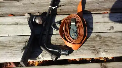 hitch with 1 7/8" ball, 2 wheel wrench bars, ratcheting tie down with 1000 lb capacity all for $ 5.0...