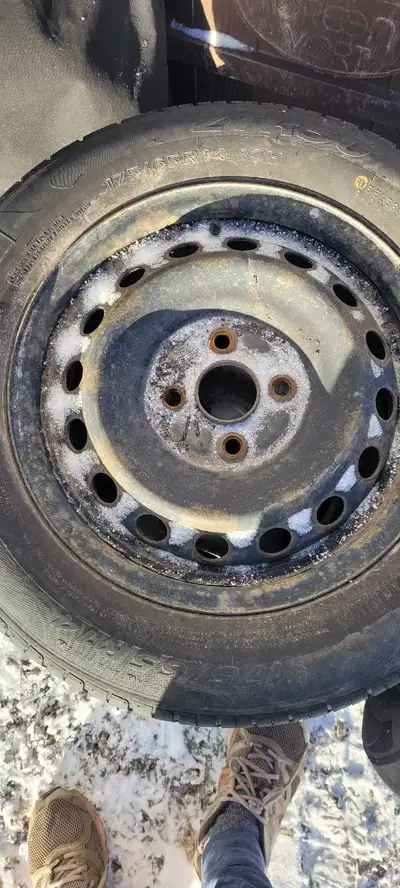 Offering a set of four tires on rims, size 175 65 14. Please note that the tread is not in great con...