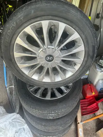 These are Hankook Energy GT all-season tires, size 215/55R17, mounted on Hyundai rims. These used ti...