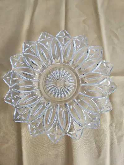 This is a beautiful pressed glass plate, perfect for adding a touch of elegance to your table settin...