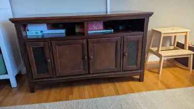 This is a solid wood TV stand or would be a great addition as a decorative piece in your room.