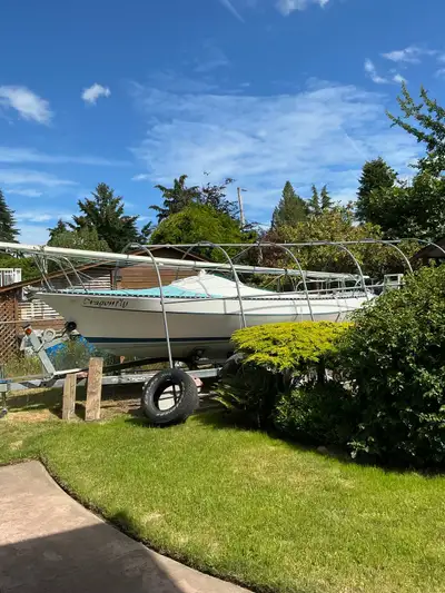 Very good condition. Comes with full set of sails, 6 HP Suzuki Four Stroke outboard engine, 2000 Kin...