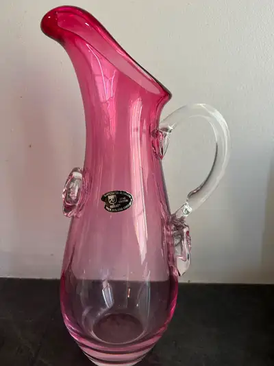 The item is a vintage Chalet Art Glass pitcher, specifically a Riekes Crisa Cranberry in Crystal mod...