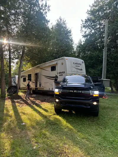 I offer towing services for RVs, travel trailers, fifth wheels, and boats using my Ram 3500 which i...