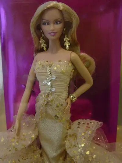 To celebrate this awesome event Robert Best has designed a beautiful 50th Anniversary Barbie Glamor...