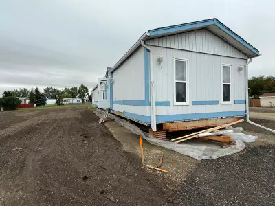in over 55 park in high River nicest lot in the park A newer furnace and hot water tank new roof 95...