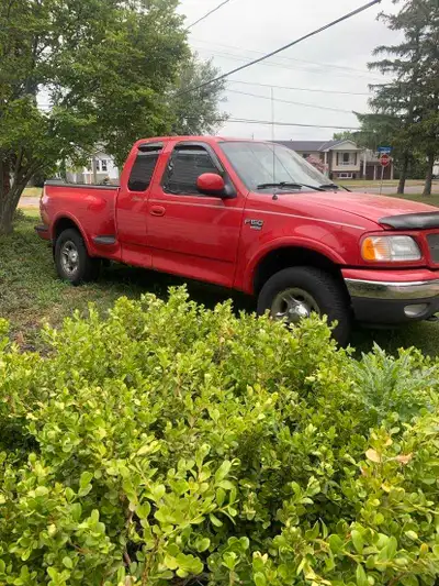 2001 ford f150 4x4 lariat model looking to sell or trade for a motorcycle harley davidson sportser o...
