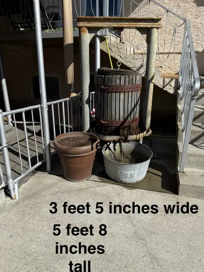 Large wine press that has been converted into a water feature. Very heavy will need help to move