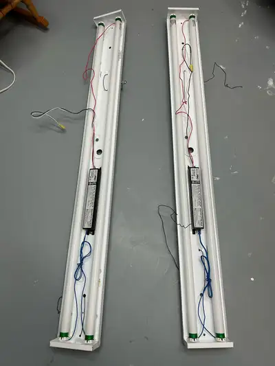 Two 4’ fluorescent light ballasts with bulbs. Free.