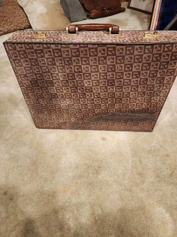 Designer briefcase with water stain