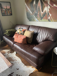  Oversized, brown, leather couch, and loveseat 
