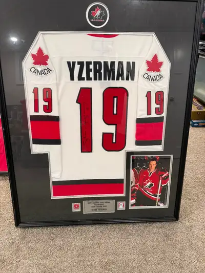 This professionally framed, autographed Steve Yzerman Team Canada jersey the signature is fully cert...