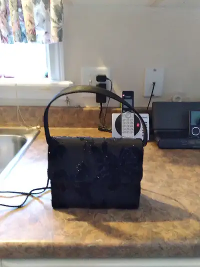 Ladies Little Black Shimmery Handbag, View more