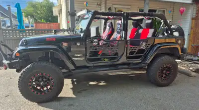 I am selling my jeep wrangler jk.4 dr.comes with full bikini top,tube doors.hard top with doors.grea...