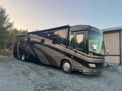 Mint condition travel supreme 40 foot diesel four slide outs completely redone inside on board gener...