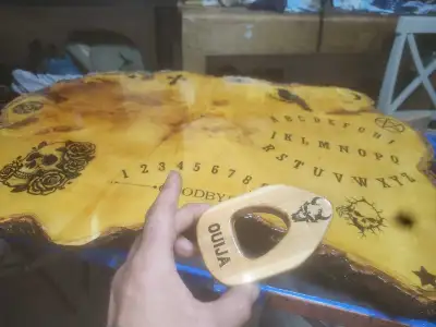 Hand made oujia board crafted from a slab of maple sealed with marine varnish with an epoxy resin to...
