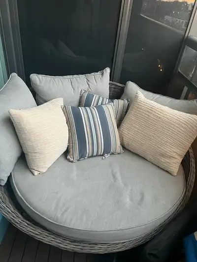 Day bed with pillows, footstool, and coffee table all wicker, brand new. 1 year old. Originally boug...