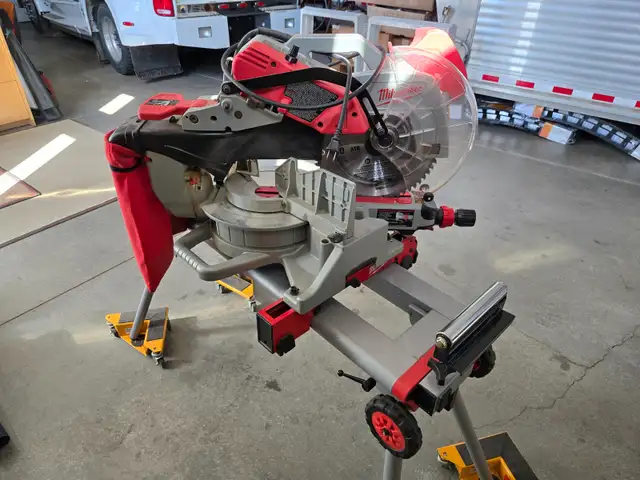 New Condition Milwaukee 12" compound dual beve sliding miter saw in Power Tools in Calgary - Image 7