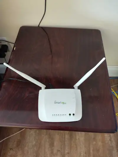 This is a SmartRG SR360n 802.11n ADSL2+ Router, it comes with it's original power supply. It is Acan...