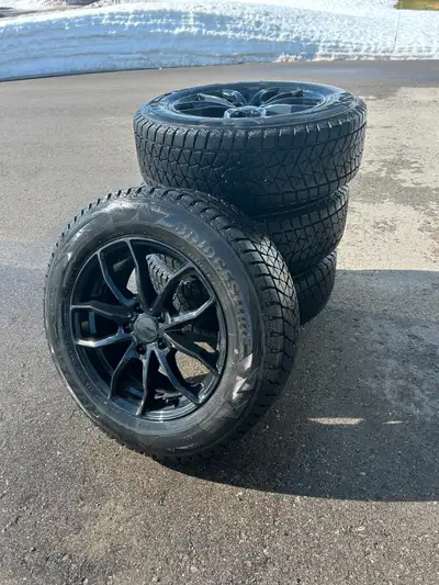 Set of 4 Bridgestone Blizzak winter tires mounted on aluminum rims. Size 225/65R17 102S. Came off of...