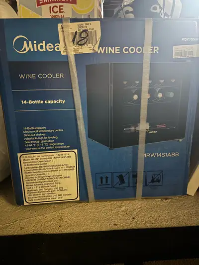This Midea wine cooler has a 14-bottle capacity, mechanical temperature control, slide-out shelves,...