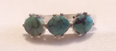 A NICE SIZE 7 - 925 STERLING SILVER RING WITH THREE GENUINE TURQUISE STONES IT IS IN PERFECT CONDITI...