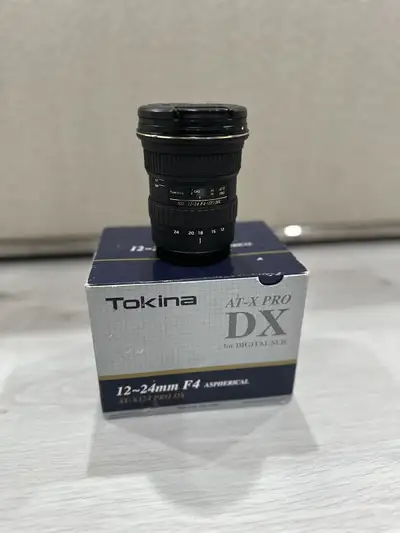 Tokina 12-24mm F4 AT-X Pro DX autofocus Lens for Canon Cameras Has UV Filter on since purchase. Come...