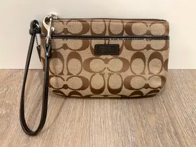 BRAND NEW! Coach signature wristlet, View more