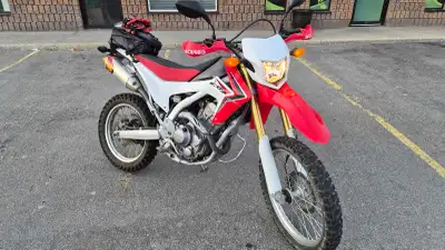 It has FMF exhaust, handguards and a raised seat. Comes with all the stock parts and a 13t front spr...