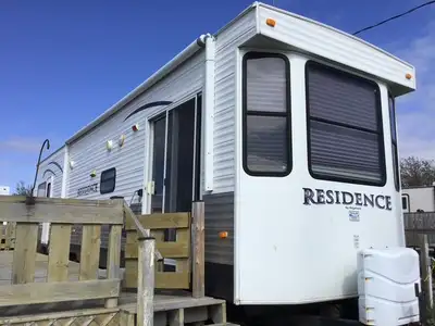2012 RESIDENCE PARK MODEL TRAILER EXTERIOR 40 feet long with full-length deck At Scalawags Camping P...