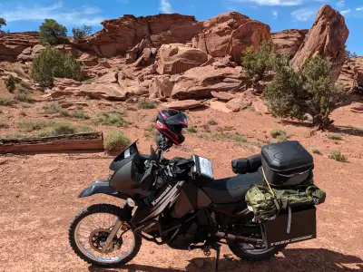 This KLR has been outfitted for adventure touring, upgraded to 680cc with the Schnitz racing piston....