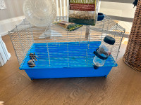 Hamster cage, bedding, ball and food