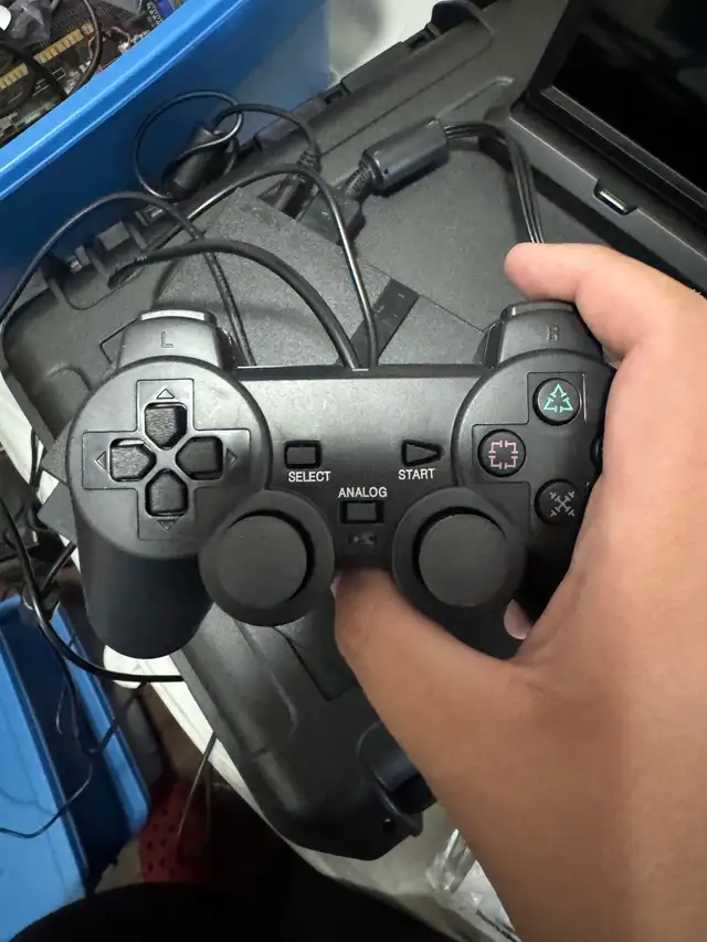 PlayStation 2 slim with games63347537469827121