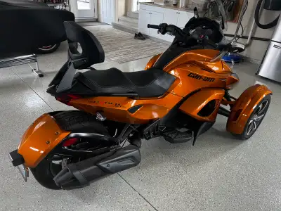 Check out this sleek, pre-owned 2014 Can-Am Spyder ST-S, a unique three-wheeled motorcycle offering...
