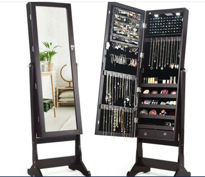 Meuble à bijoux avec miroir sur pieds. Peut s'installer au mur également. Dimensions: 14"l X 46"h X...