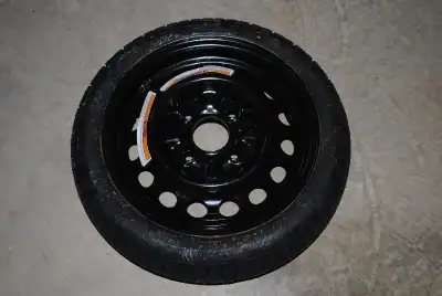 One new, never used tires T115/70D14. This is a backup tire for195/60R15.