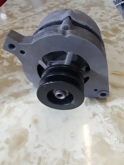 Ford alternator. Was a spare for a 1973 Ford. Has double belt pulley. Recently checked and works as...