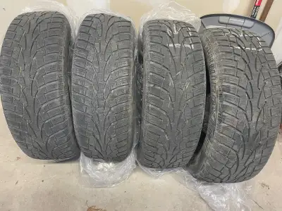 Set of four used Uniroyal Tiger Paw Winter Tires 225 65R 17. Used for four winters. About 6/32 tread...